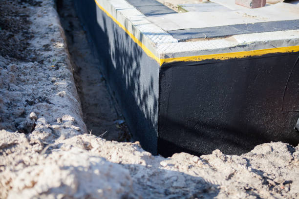 Professional Waterproofing technician working in Williamsburg, IN